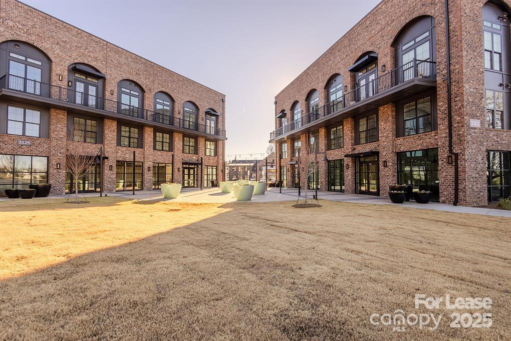3110 Doe River Way, Unit CHADWICK Matthews, NC 28105 - Photo 1 of 48 a tall building with a large windows