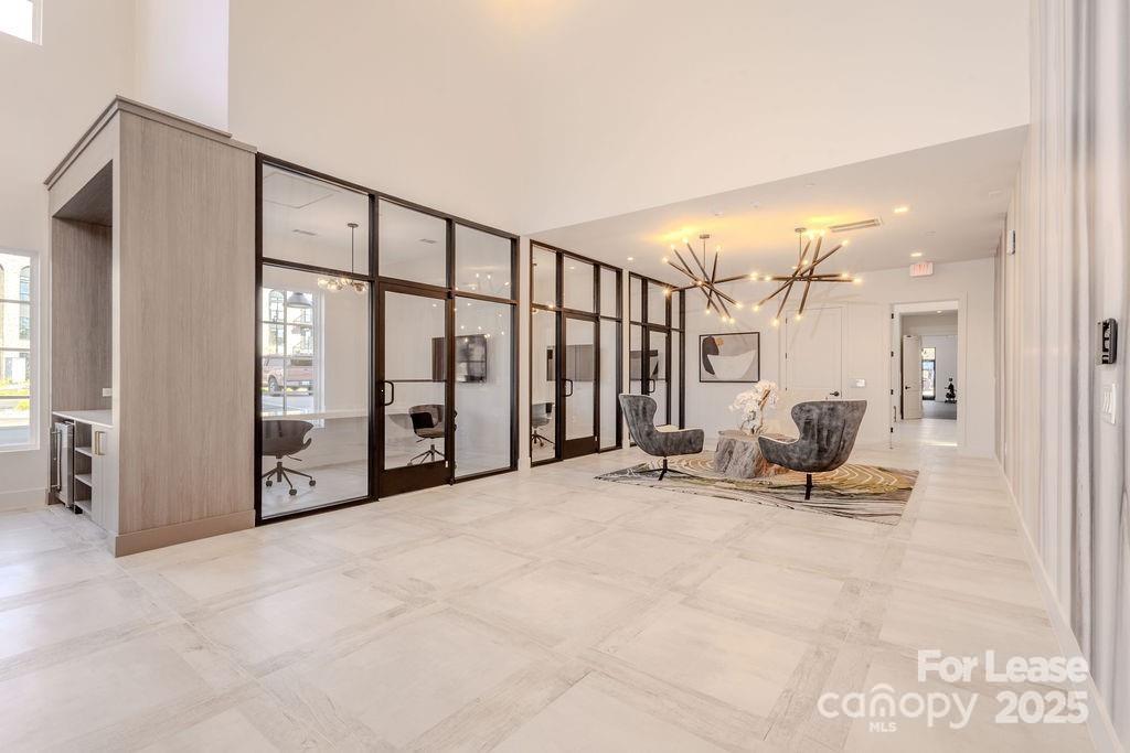 3110 Doe River Way, Unit CHADWICK Matthews, NC 28105 - Photo 19 of 48 a view of a hallway with seating area