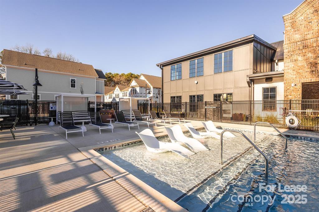 3110 Doe River Way, Unit CHADWICK Matthews, NC 28105 - Photo 2 of 48 a view of a swimming pool with outdoor seating