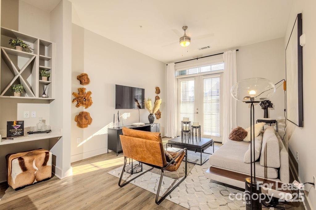 3110 Doe River Way, Unit CHADWICK Matthews, NC 28105 - Photo 36 of 48 a living room with furniture and a flat screen tv
