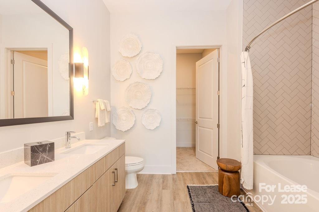 3110 Doe River Way, Unit CHADWICK Matthews, NC 28105 - Photo 42 of 48 a bathroom with a sink a toilet and shower