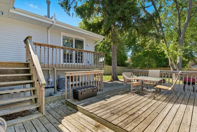 a view of deck with wooden floor and outdoor seating