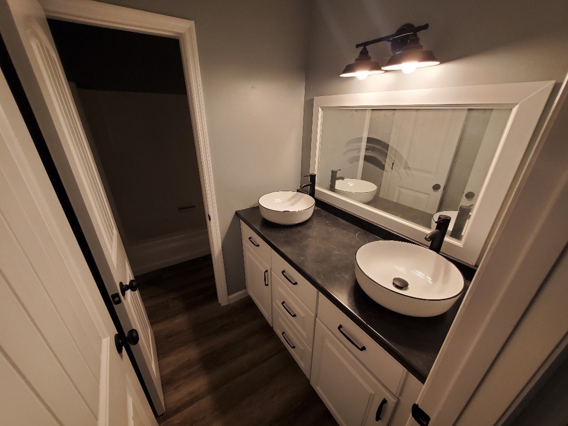 1317 Pierce Road Madison, TN 37115 - Photo 13 of 18 a bathroom with a granite countertop sink mirror vanity and toilet