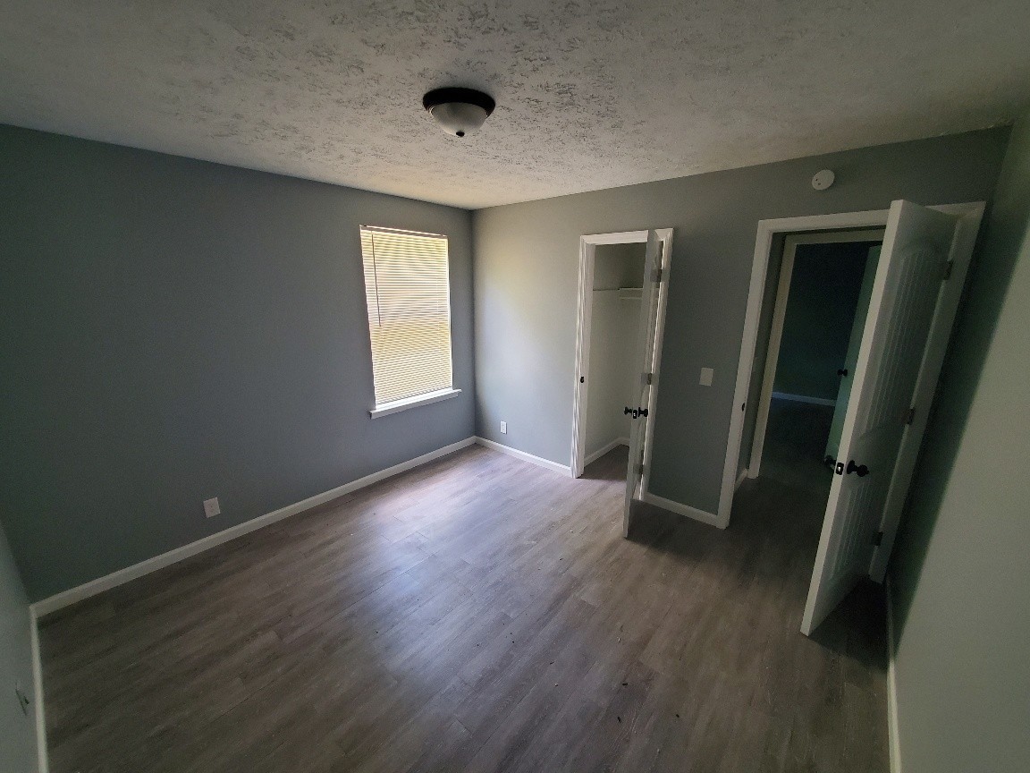 1317 Pierce Road Madison, TN 37115 - Photo 15 of 18 an empty room with wooden floor and a window