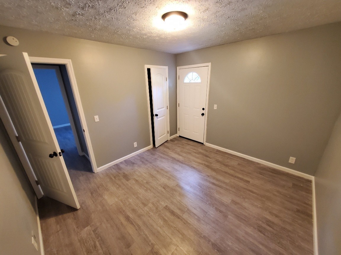 1317 Pierce Road Madison, TN 37115 - Photo 16 of 18 an empty room with wooden floor and windows