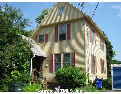 53 Spring Street Windsor Locks, CT 06096 - Photo 1 of 1 a front view of a house with plants