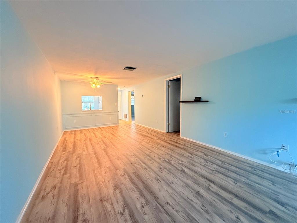 4221 Touchton Place, Unit 4221 New Port Richey, FL 34652 - Photo 20 of 37 a view of empty room with wooden floor