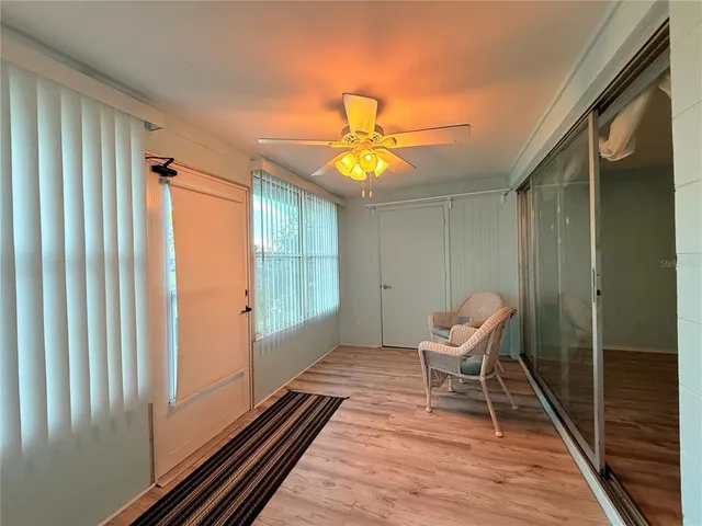 a chair and table in a room next to a window