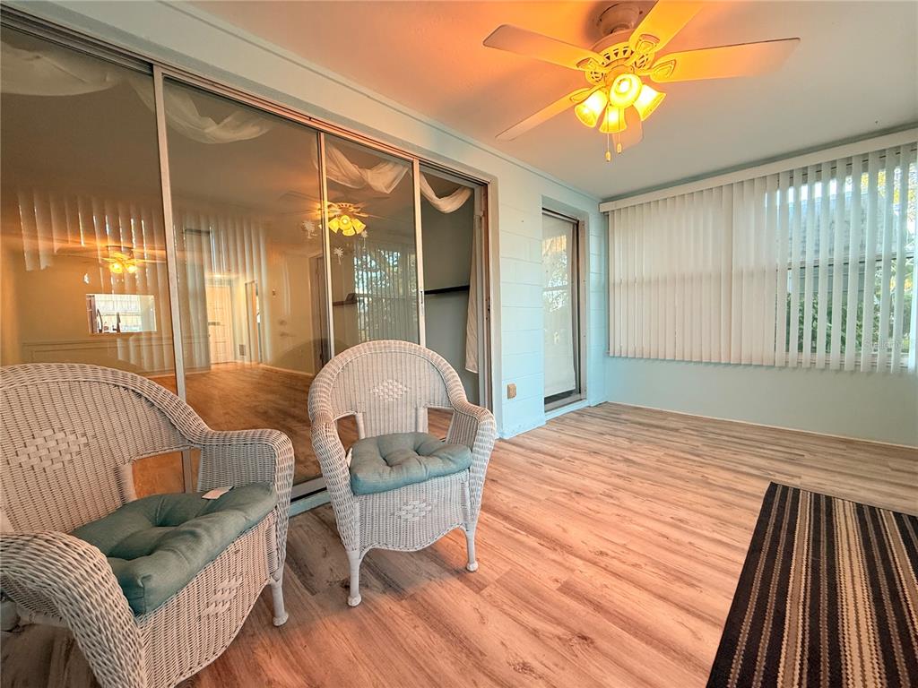 4221 Touchton Place, Unit 4221 New Port Richey, FL 34652 - Photo 23 of 37 a bedroom with a bed and wooden floor