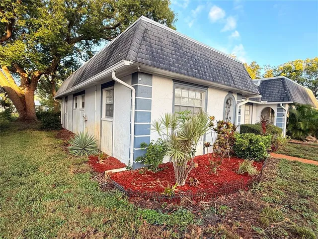 a house view with a garden space