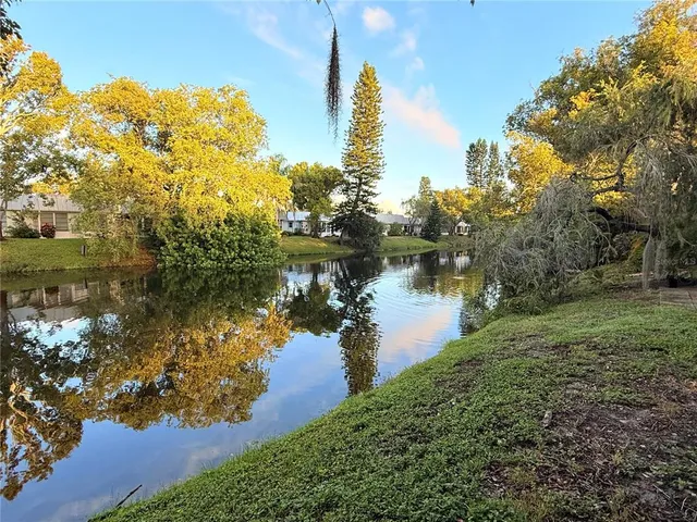 a view of a lake with a big yard