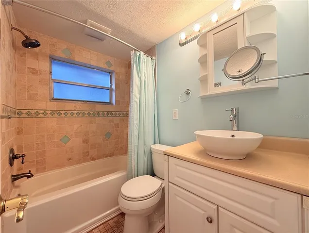 a bathroom with a sink a toilet and a bathtub