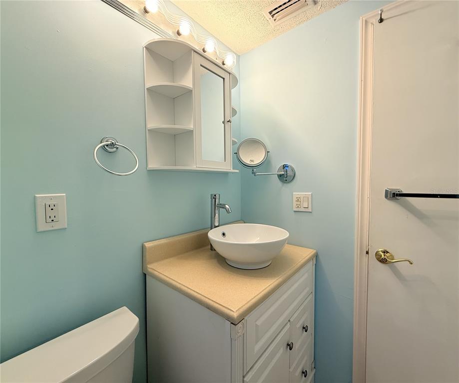 4221 Touchton Place, Unit 4221 New Port Richey, FL 34652 - Photo 8 of 37 a bathroom with a sink and a mirror