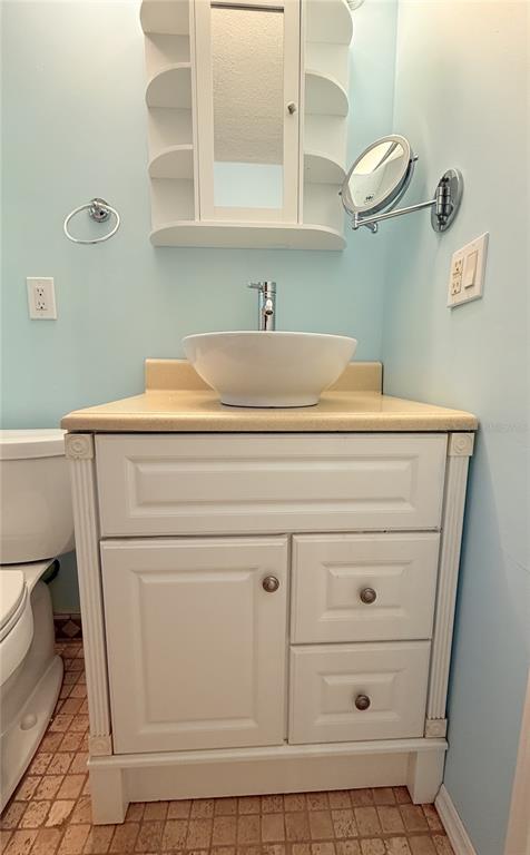 4221 Touchton Place, Unit 4221 New Port Richey, FL 34652 - Photo 9 of 37 a close view of a sink and a mirror