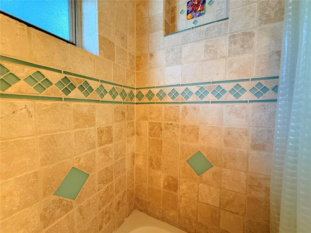 4221 Touchton Place, Unit 4221 New Port Richey, FL 34652 - Photo 10 of 37 a bathroom with a shower