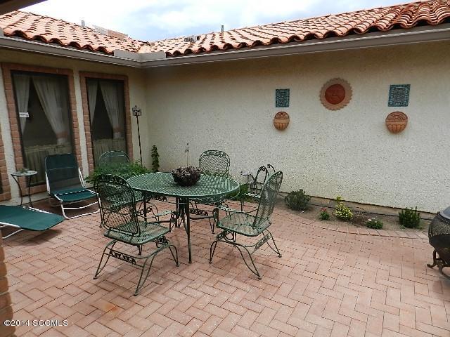 471 Camino Providencia Rio Rico, AZ 85648 - Photo 38 of 49 a backyard of a house with table and chairs