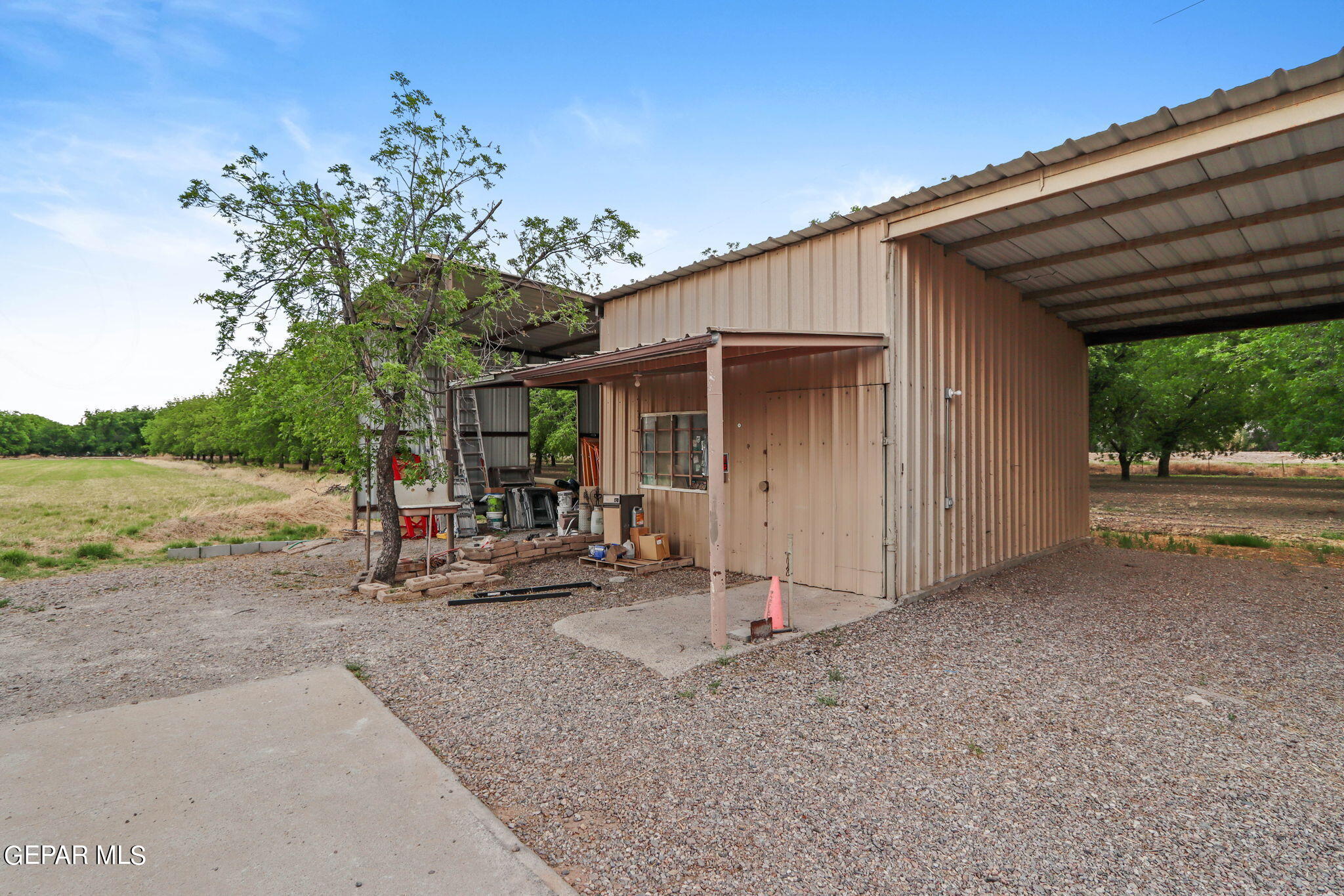 3025-3035 West O'Hara Road Anthony, NM 88021 - Photo 17 of 41 a view of a house with backyard and porch