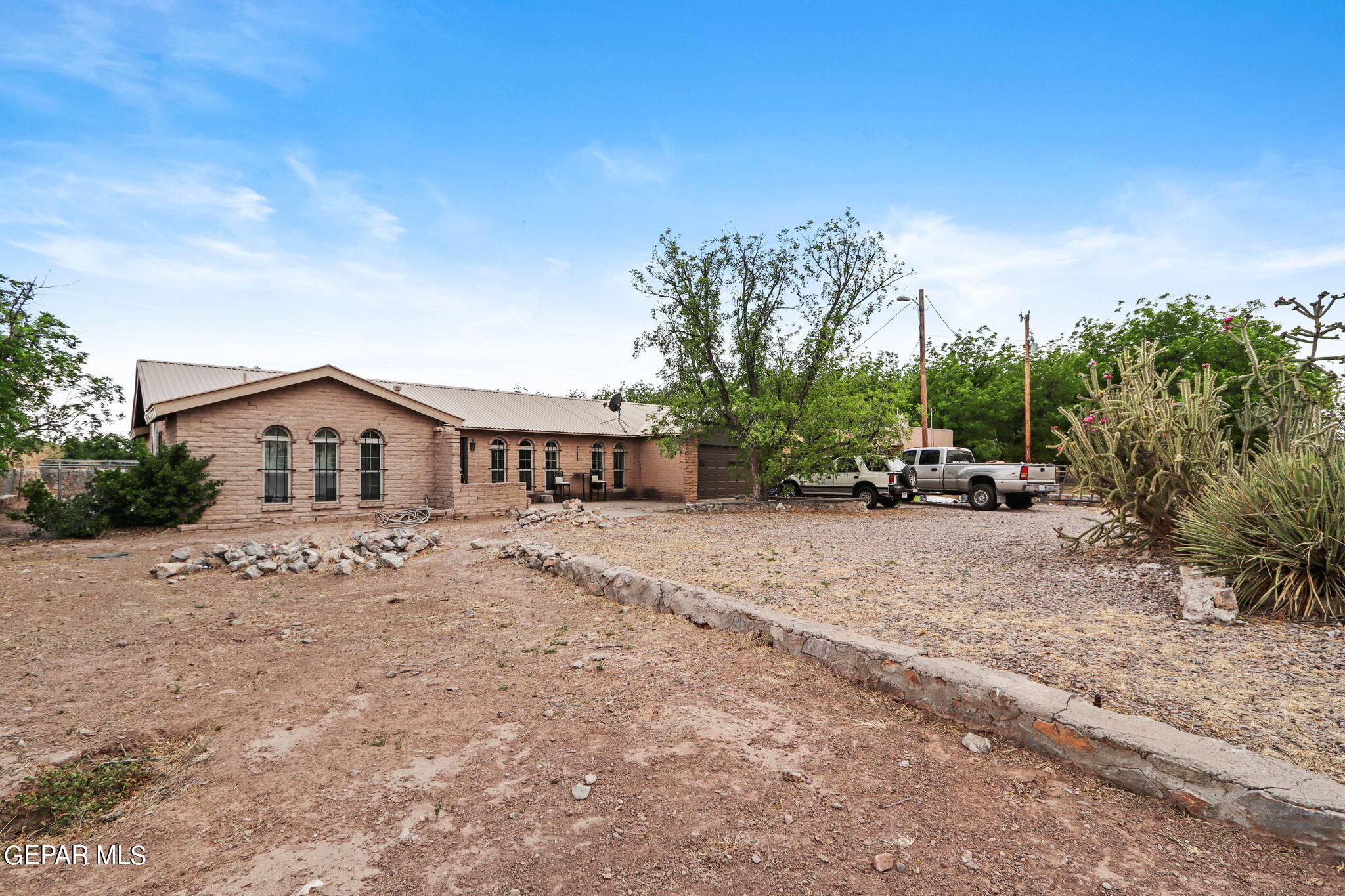 3025-3035 West O'Hara Road Anthony, NM 88021 - Photo 21 of 41 a view of house with car parked beside of it