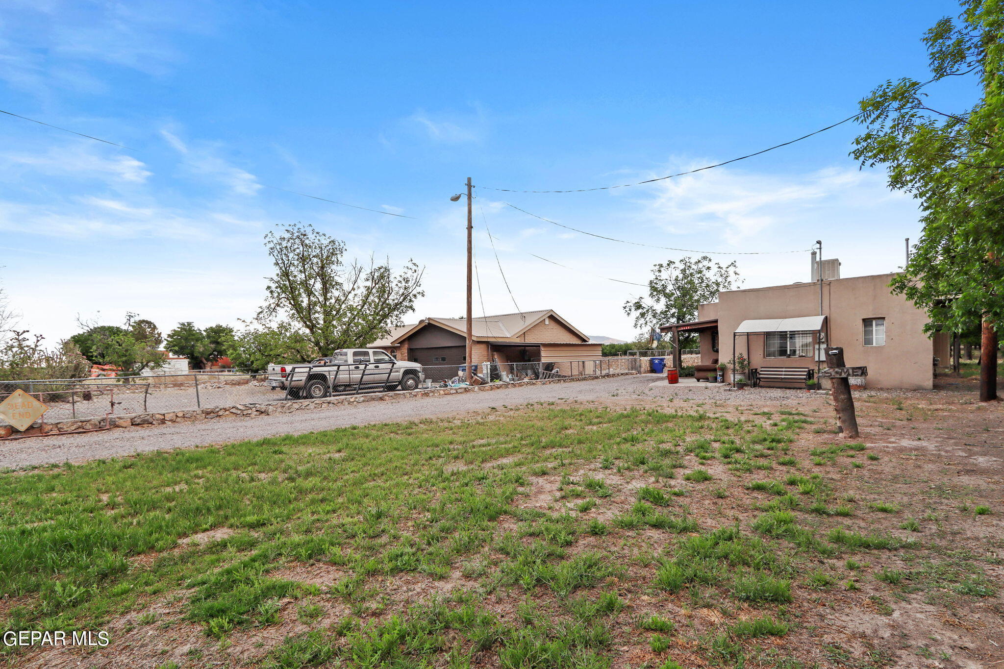 3025-3035 West O'Hara Road Anthony, NM 88021 - Photo 22 of 41 a view of a house with a yard and sitting area