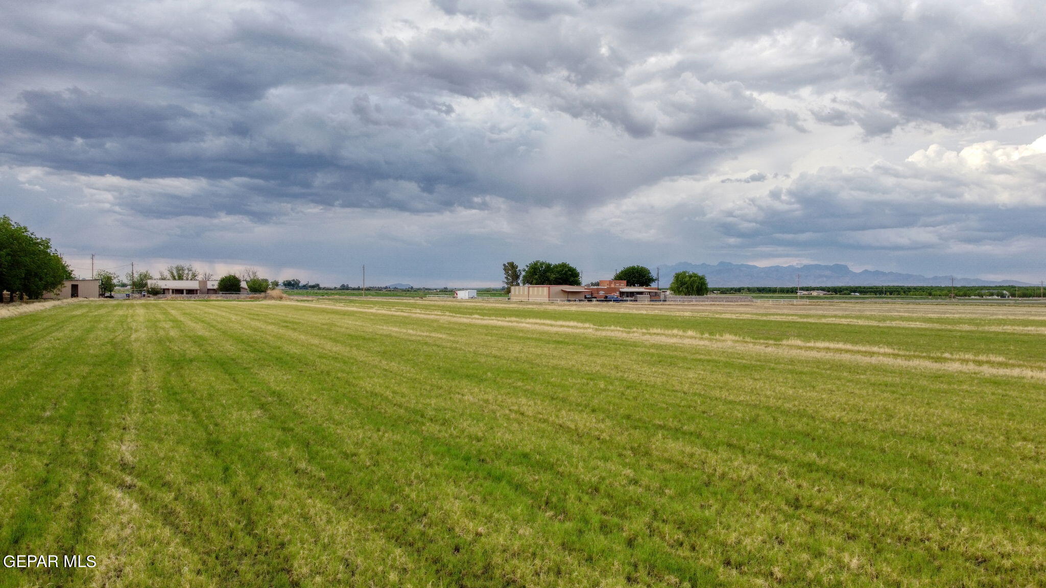 3025-3035 West O'Hara Road Anthony, NM 88021 - Photo 5 of 41 a view of a water and lots of trees