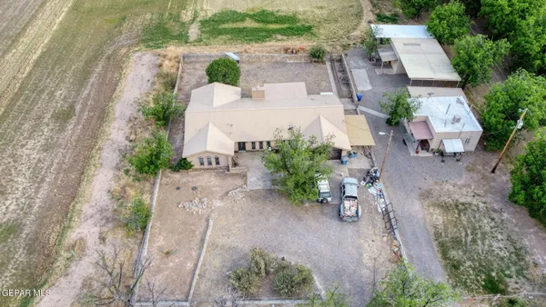 an aerial view of a house with a yard and a garden