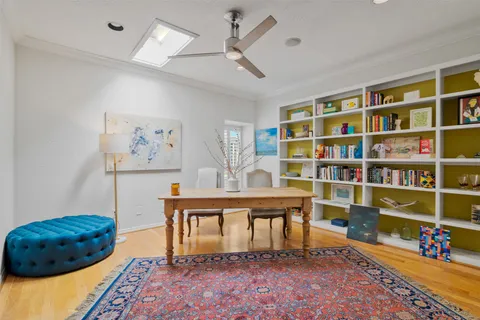 a living room with furniture and a rug