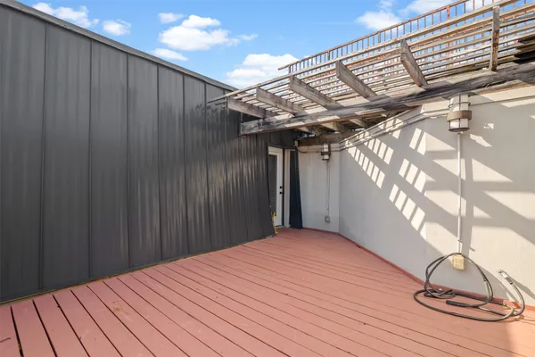 a view of a palm tree in front of a room