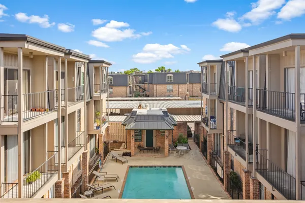 a view of swimming pool with outdoor seating