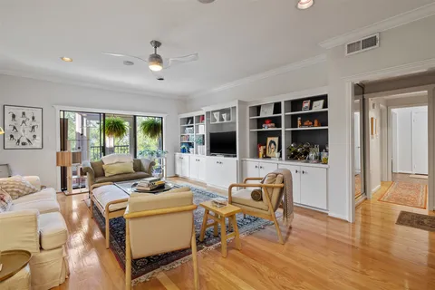 a living room with furniture fireplace and a flat screen tv