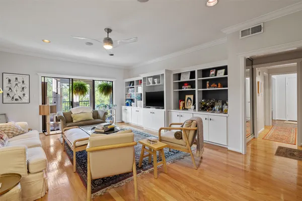 a living room with furniture fireplace and a flat screen tv