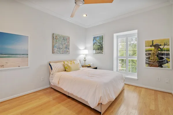 a bedroom with a large bed and a window