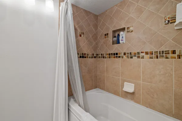 a view of bedroom with a bed and a book shelf
