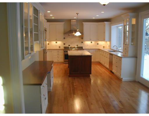 14 Slocum Road Lexington, MA 02421 - Photo 5 of 8 a large kitchen with kitchen island a sink stainless steel appliances and cabinets