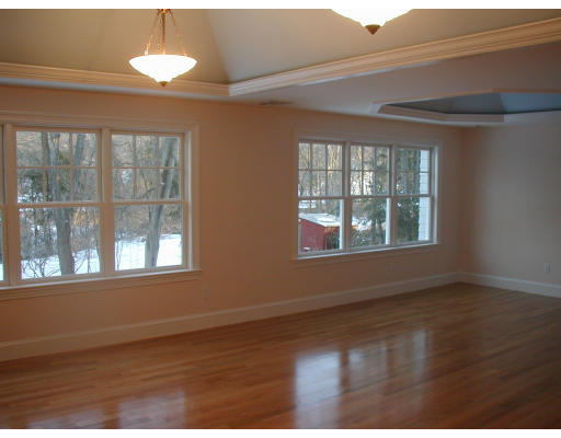 14 Slocum Road Lexington, MA 02421 - Photo 8 of 8 an empty room with wooden floor and windows
