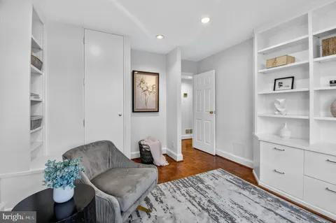 a bedroom with a bed and a table in it