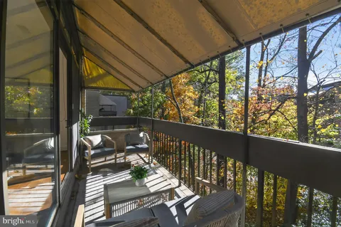 a view of balcony with furniture
