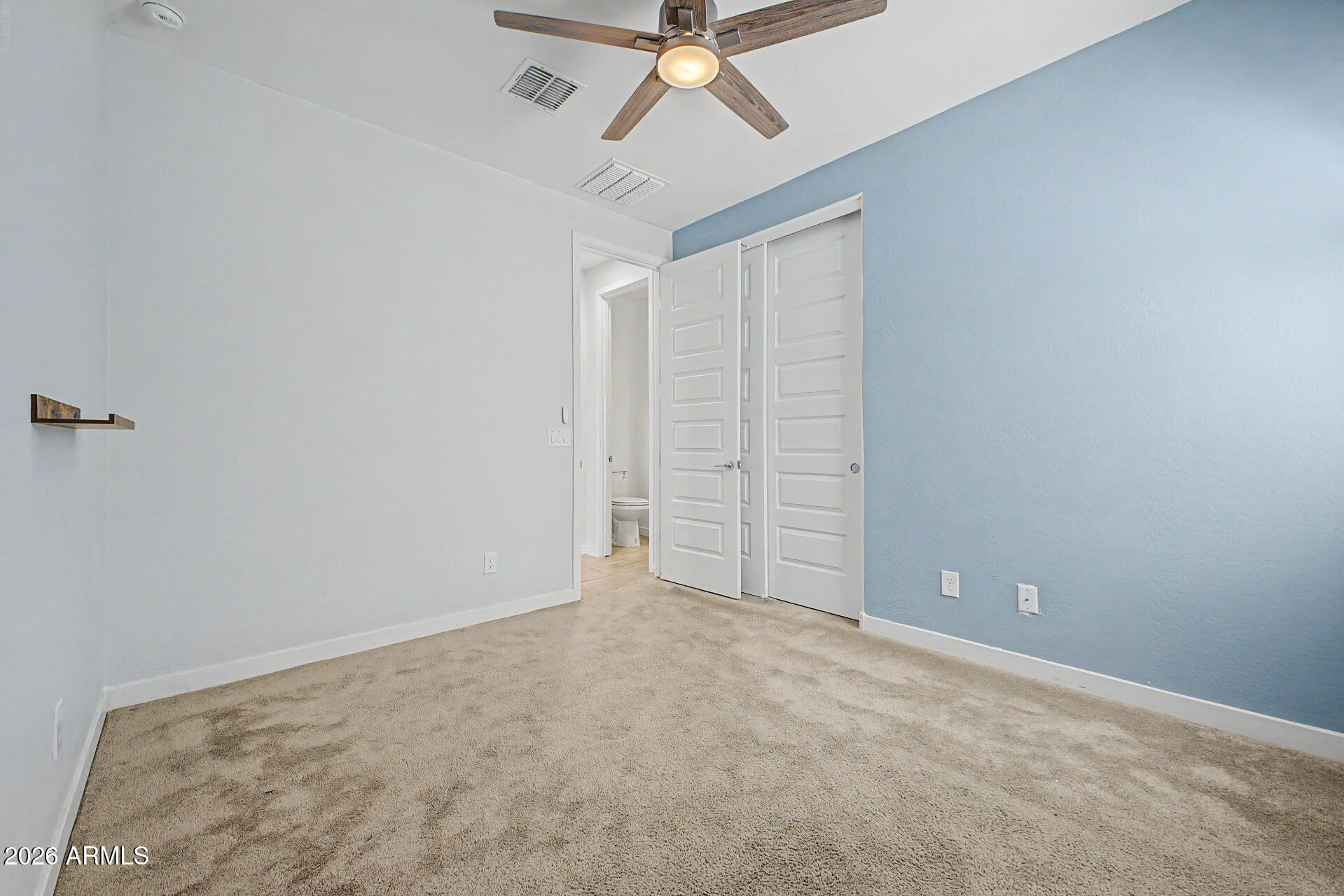 23080 East Stacey Road Queen Creek, AZ 85142 - Photo 34 of 42 a view of an empty room with a ceiling fan