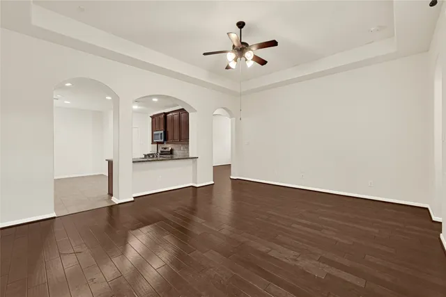 a large kitchen with stainless steel appliances granite countertop a stove and a sink
