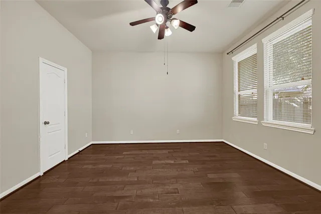 a bathroom with a toilet a sink and a window