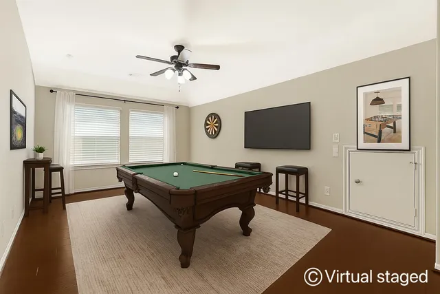 a bathroom with a granite countertop sink a toilet and a mirror