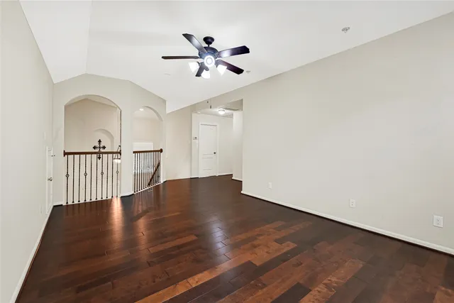 a view of a backyard with a large tree