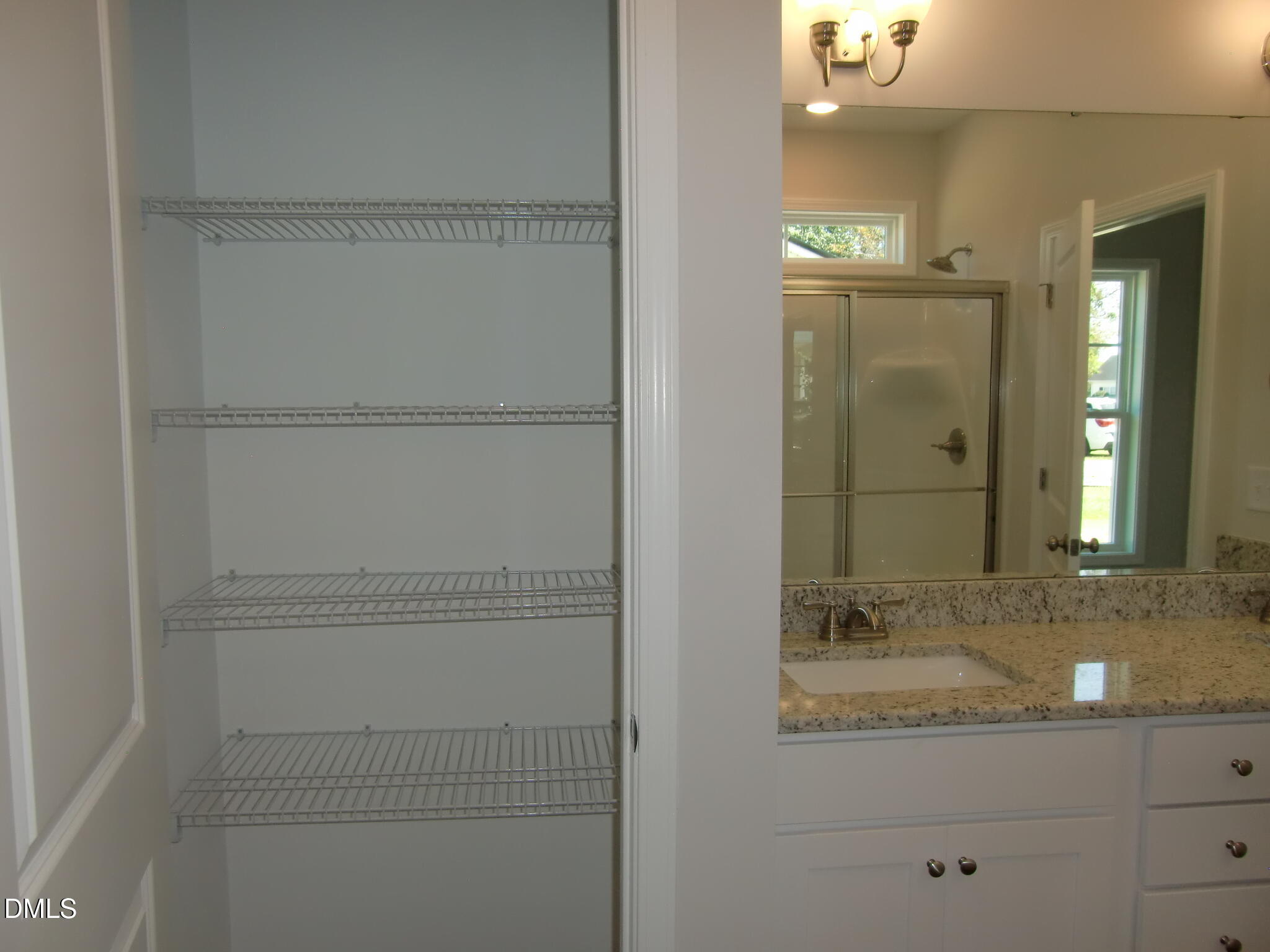 100 Covington Lane Dunn, NC 28334 - Photo 47 of 61 a bathroom with a granite countertop sink and a mirror