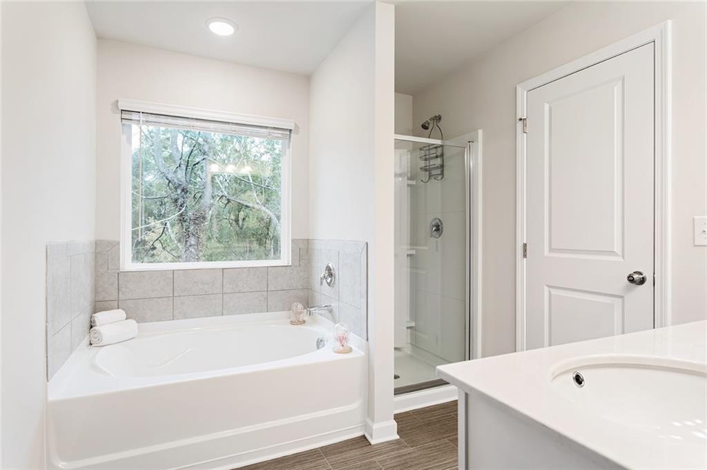 2824 Saratoga Lake View Decatur, GA 30034 - Photo 17 of 30 a bathroom with a bathtub and a shower