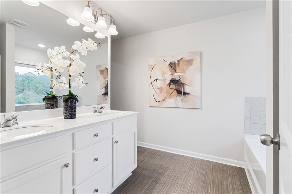 2824 Saratoga Lake View Decatur, GA 30034 - Photo 18 of 30 a bathroom with a sink mirror and vanity