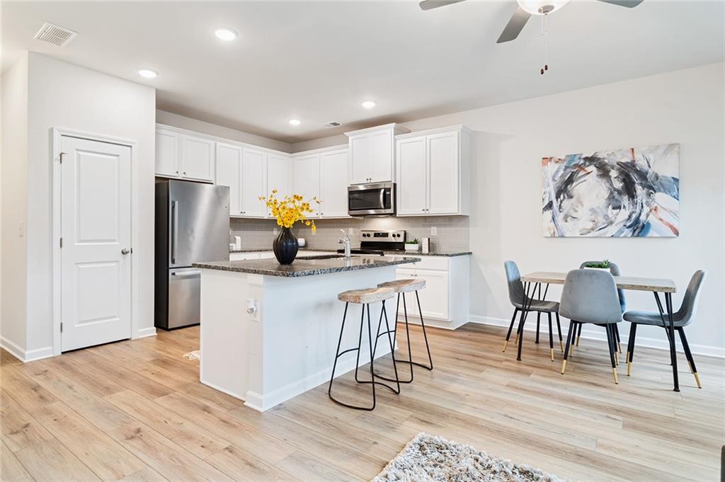2824 Saratoga Lake View Decatur, GA 30034 - Photo 2 of 30 a kitchen with a refrigerator and white cabinets