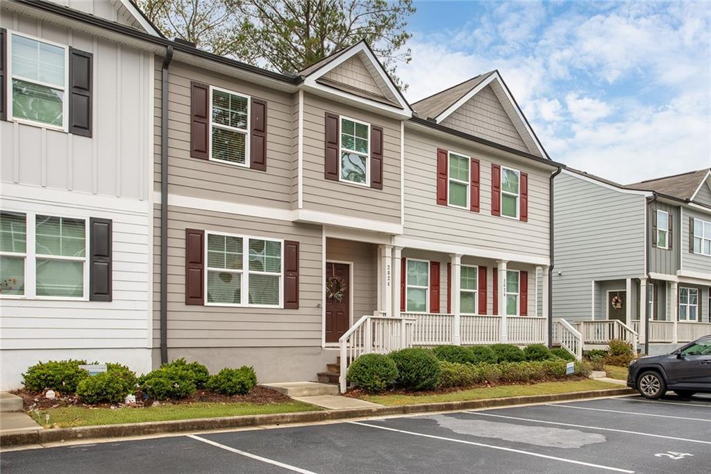 2824 Saratoga Lake View Decatur, GA 30034 - Photo 26 of 30 a front view of a house with a yard and garage