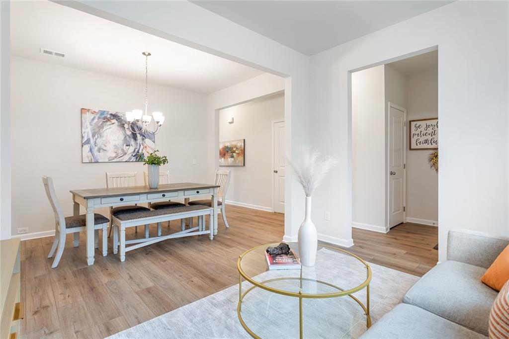 2824 Saratoga Lake View Decatur, GA 30034 - Photo 8 of 30 a living room with furniture and a wooden floor