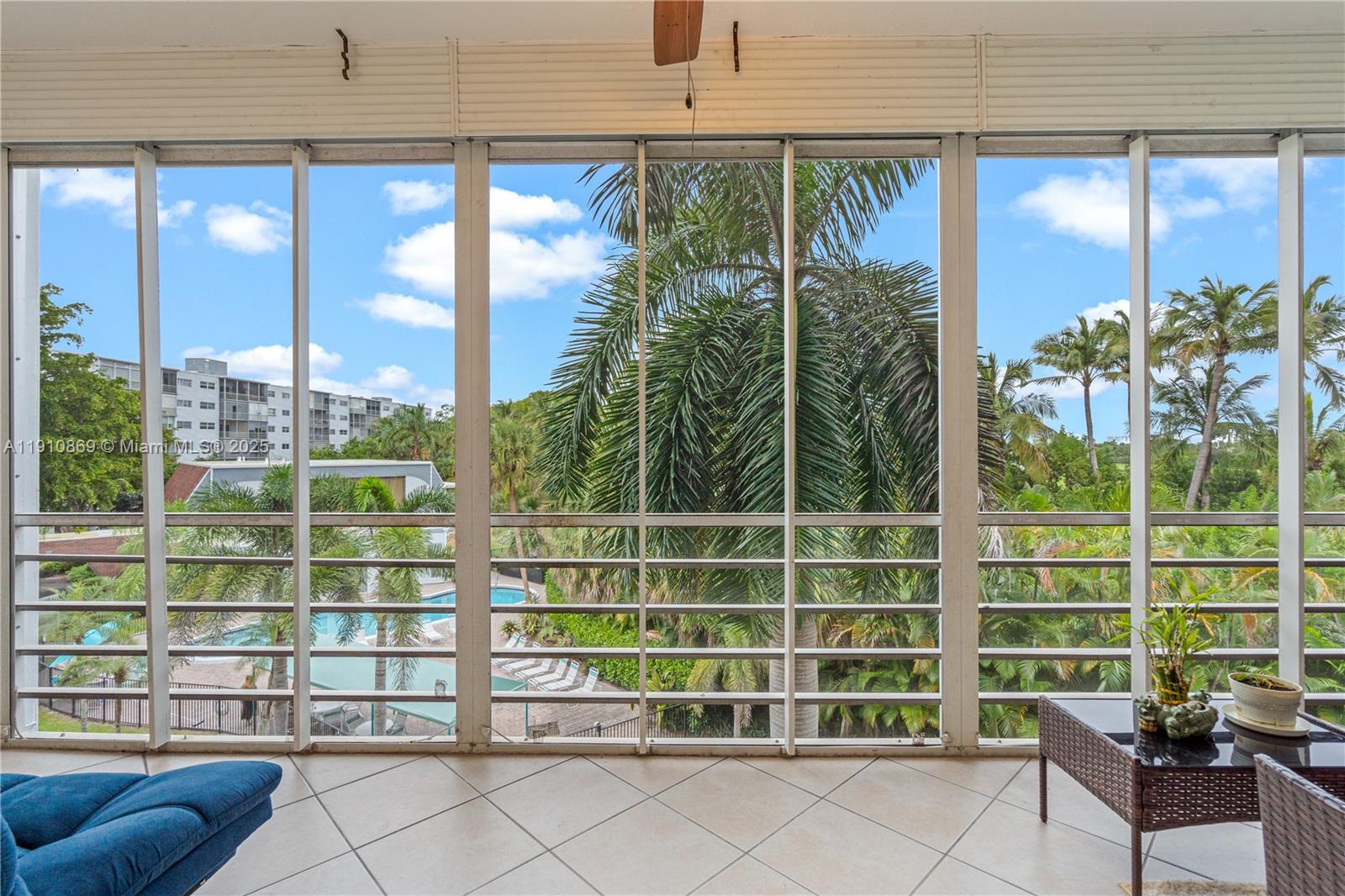 1425 Atlantic Shores Boulevard, Unit 409 Hallandale Beach, FL 33009 - Photo 13 of 30 a view of a balcony with floor to ceiling windows and wooden fence