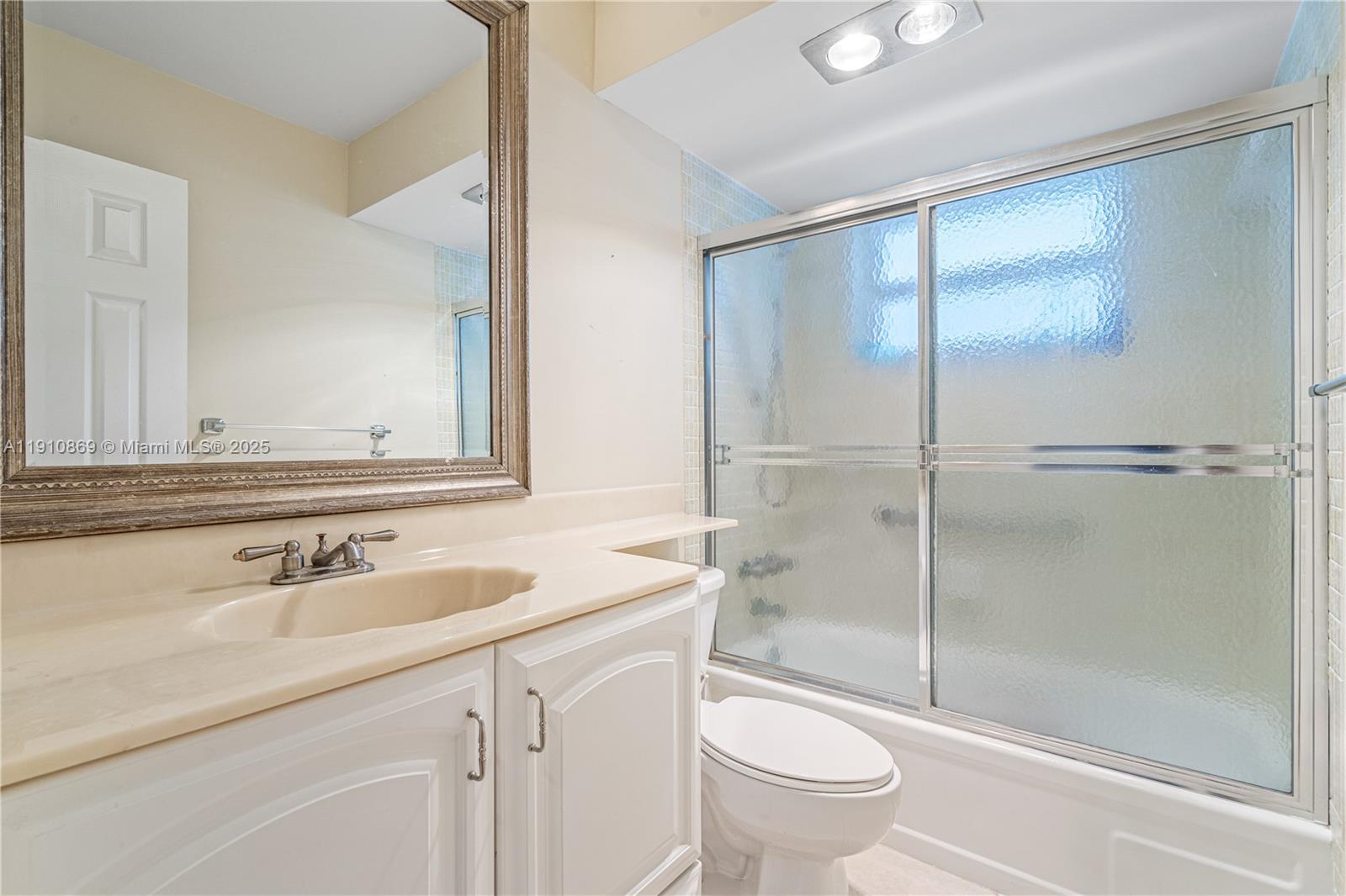 1425 Atlantic Shores Boulevard, Unit 409 Hallandale Beach, FL 33009 - Photo 16 of 30 a bathroom with a sink toilet and shower