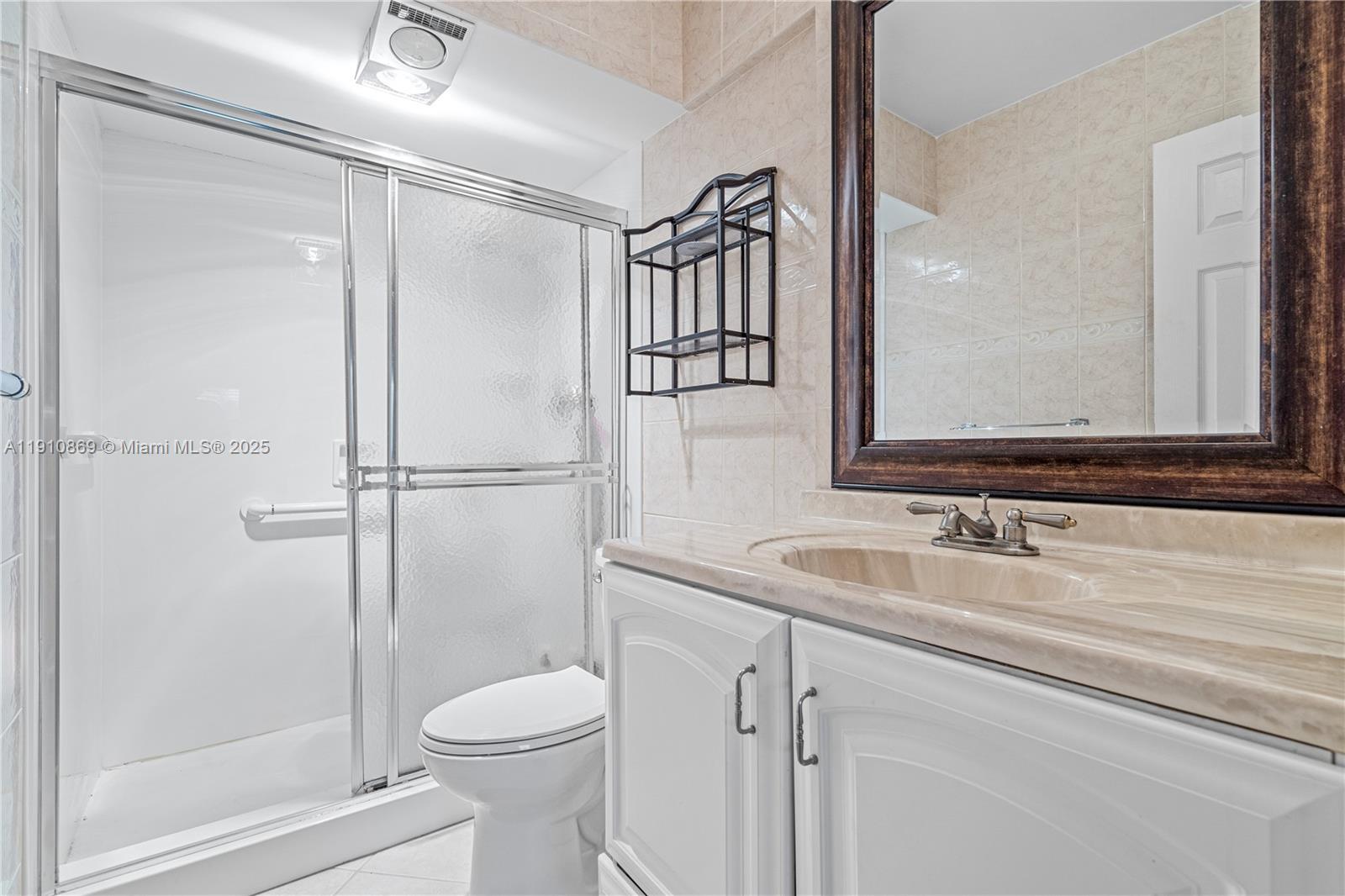 1425 Atlantic Shores Boulevard, Unit 409 Hallandale Beach, FL 33009 - Photo 23 of 30 a bathroom with a sink toilet and shower